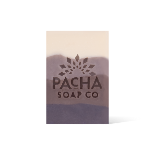 A 4 Tiered bar soap, ranging from cream and gradients down to a dark brown. The Pacha Soap Co. Logo is placed in the middle.