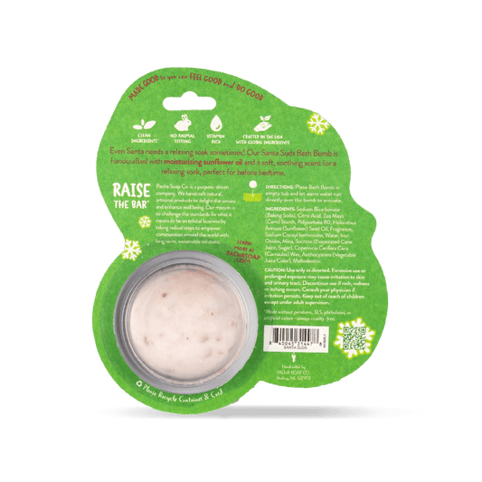 Pacha Soap Kid's green Santa Suds's bath bomb card, decorated with multicolored snowflakes and Sweet chamomile scented. Back of product view with product promises and ingredient list.