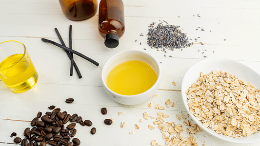 Image of essential oils and ingredients on a white table