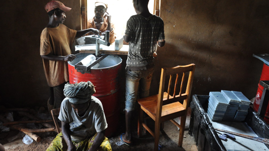 Image of group of people making bar soap
