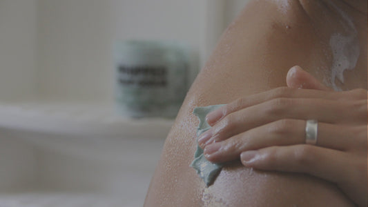 Image of person using Pacha Soap products in bath tub