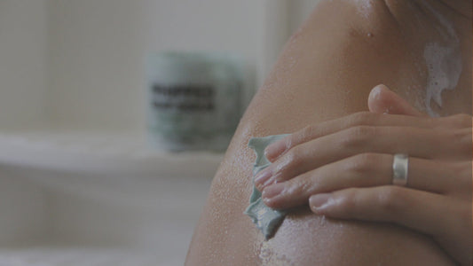Image of person using Pacha Soap products in bath tub