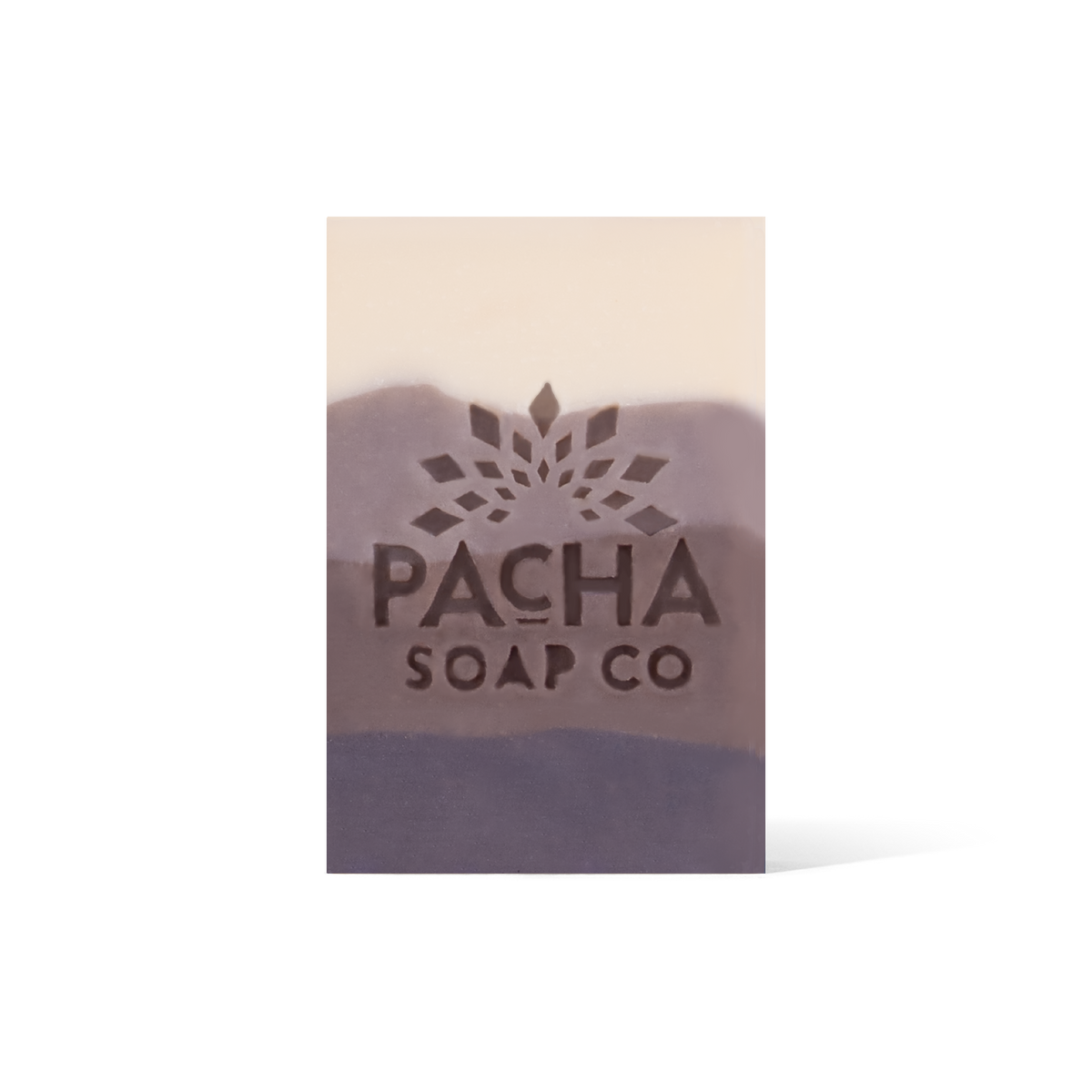 A 4 Tiered bar soap, ranging from cream and gradients down to a dark brown. The Pacha Soap Co. Logo is placed in the middle.