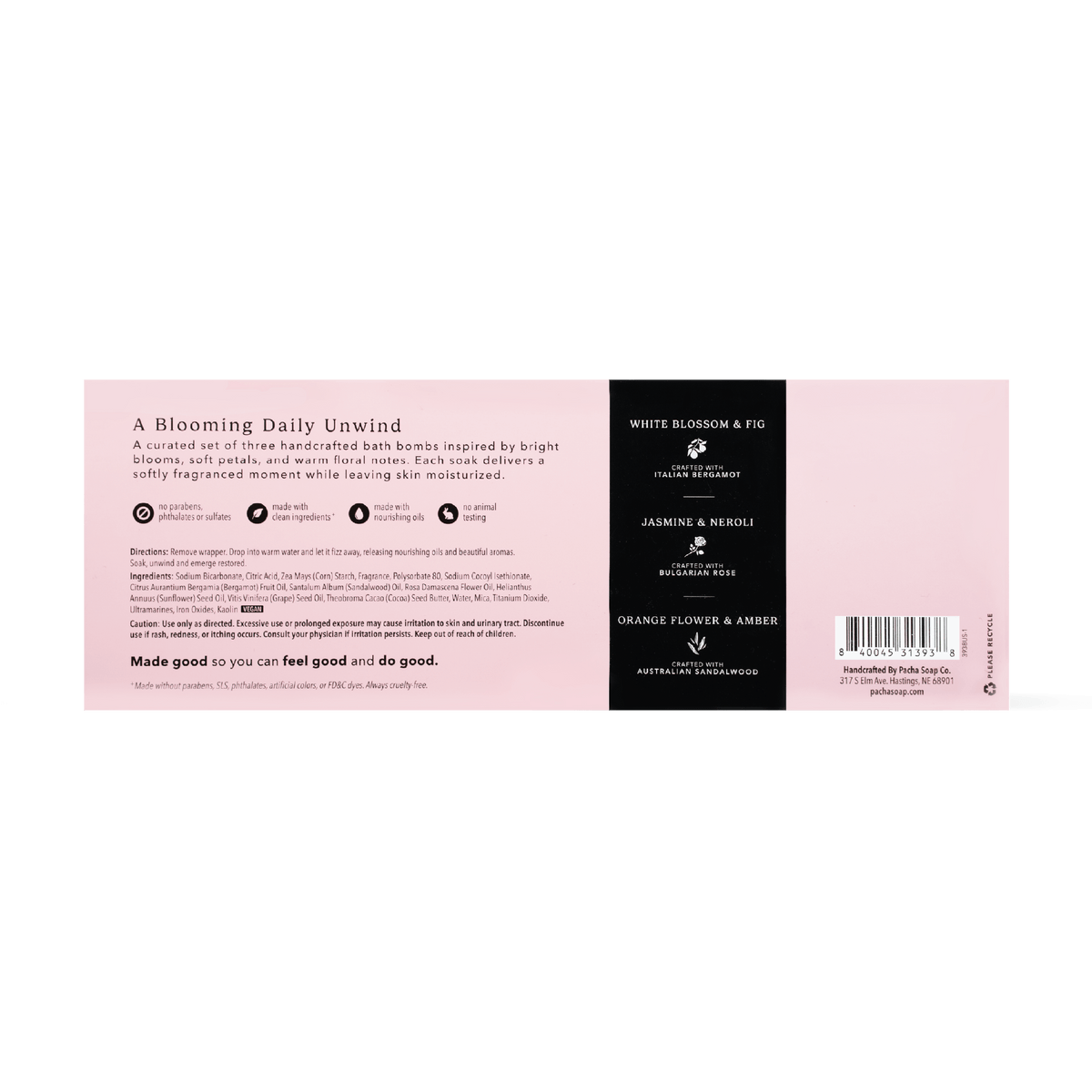 The back of a bath bomb package showing product details, ingredients, and a barcode. The design features a soft pink background with a black vertical column on the right containing white text for 'White Blossom & Fig', 'Jasmine & Neroli', and 'Orange Flower & Amber'.