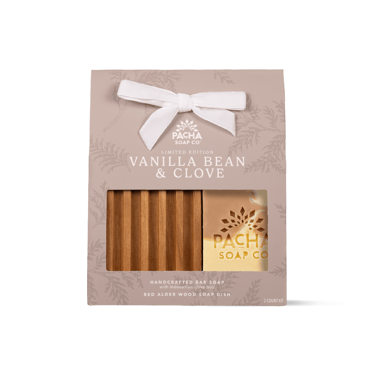 Pacha Soap Co. Vanilla Bean & Clove limited edition gift set in a beige bag with a white bow, showing one Vanilla Bean & Clove bar soap and a wooden soap dish through a clear window.