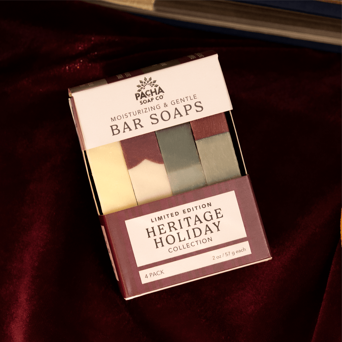 Front of Pacha Soap Co's Bar Soap Set with a window showing the barsoaps. The Set is sat on a deep red velvet fabric.