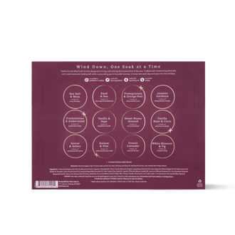 The back of a bath bomb product box in a burgundy color, featuring circular illustrations of different bath bomb blends with their names printed underneath.