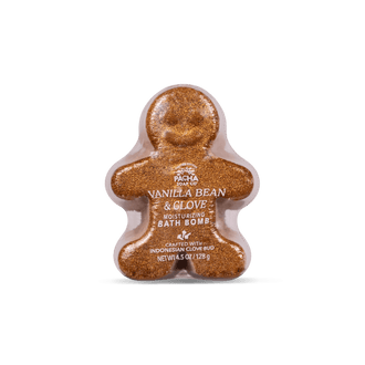 A gingerbread man-shaped bath bomb by Pacha Soap with a sparkling golden-brown glittery texture, centered on a clean white background.