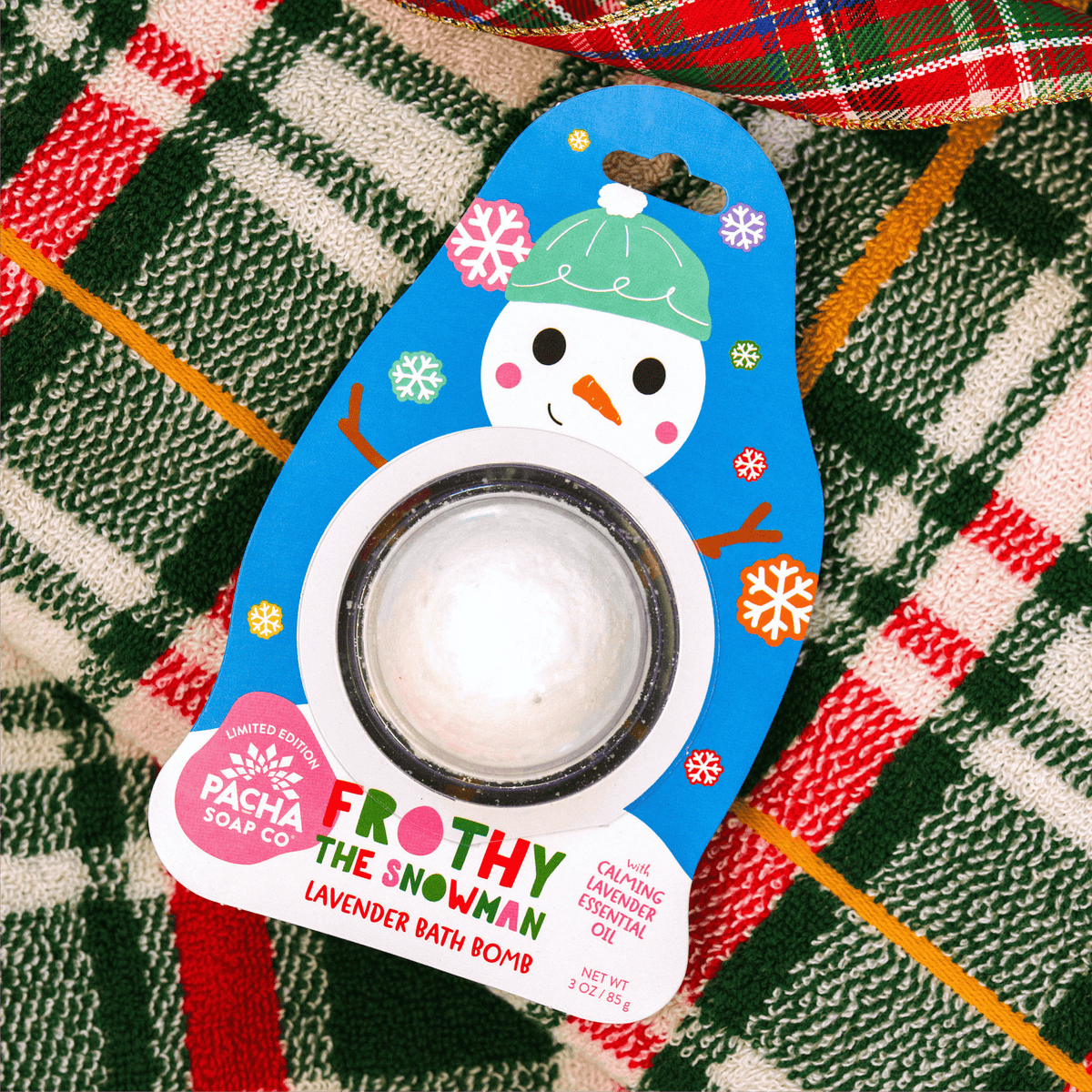 Pacha Soap Kid's Bath Bomb ard "FROTHY THE SNOWMAN" on a bright plaid background