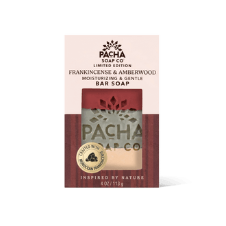 Pacha Soap Co Frankincense & Amberwood Bar Soap in its retail packaging, featuring a cream and dark red design with a clear window showing the soap bar inside.