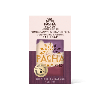 Pacha Soap Co. Limited Edition Pomegranate & Orange Peel Bar Soap in its retail packaging, featuring a cream and deep purple box with a clear window showing the bar soap inside.