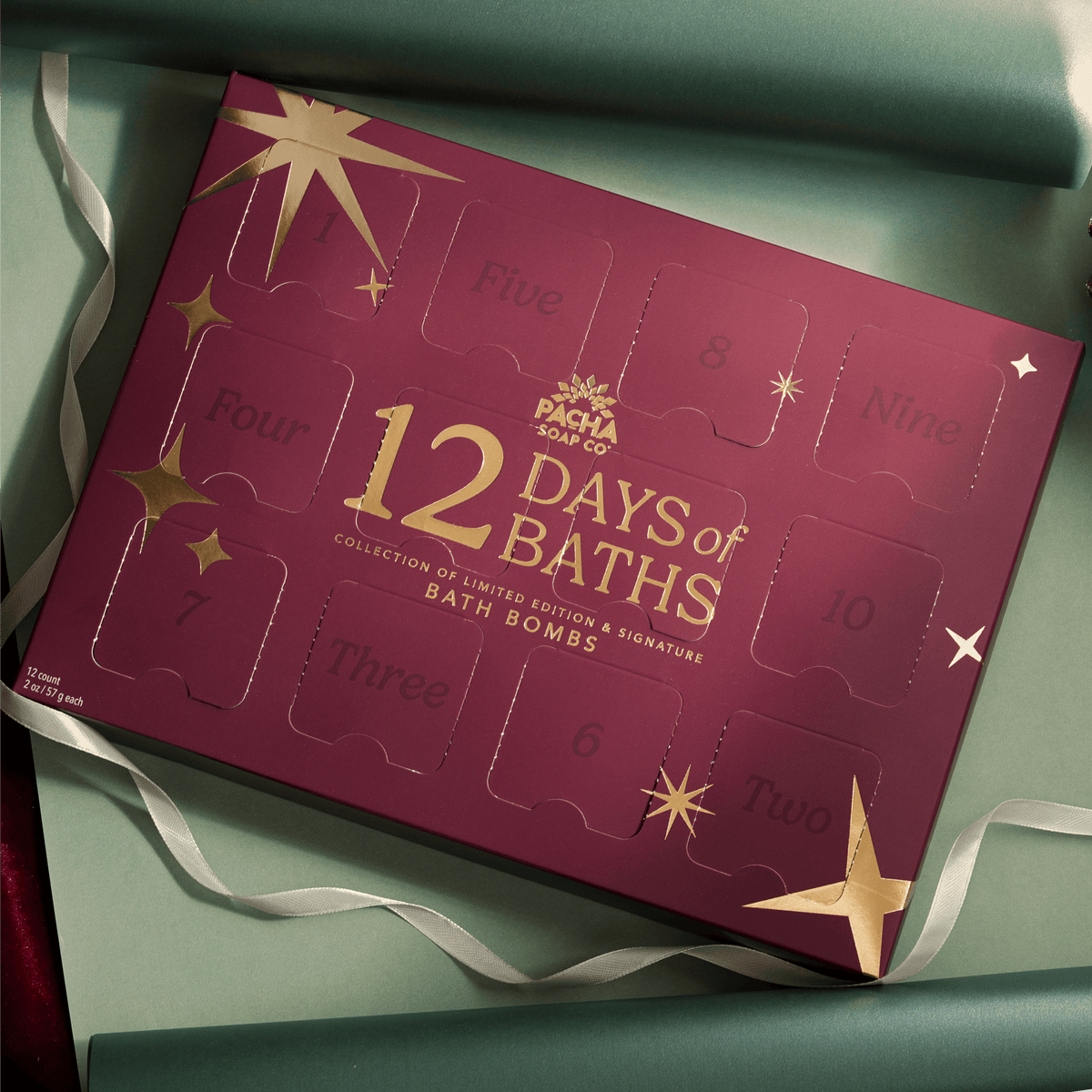 12 Days of Baths Advent Calendar with Handcrafted bathbombs made by Pacha Soap Co in a beautiful setting along with ornaments and ribbon