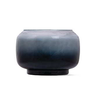 A round glass candle with a smooth gradient finish transitioning from light blue at the top to deep navy blue at the base