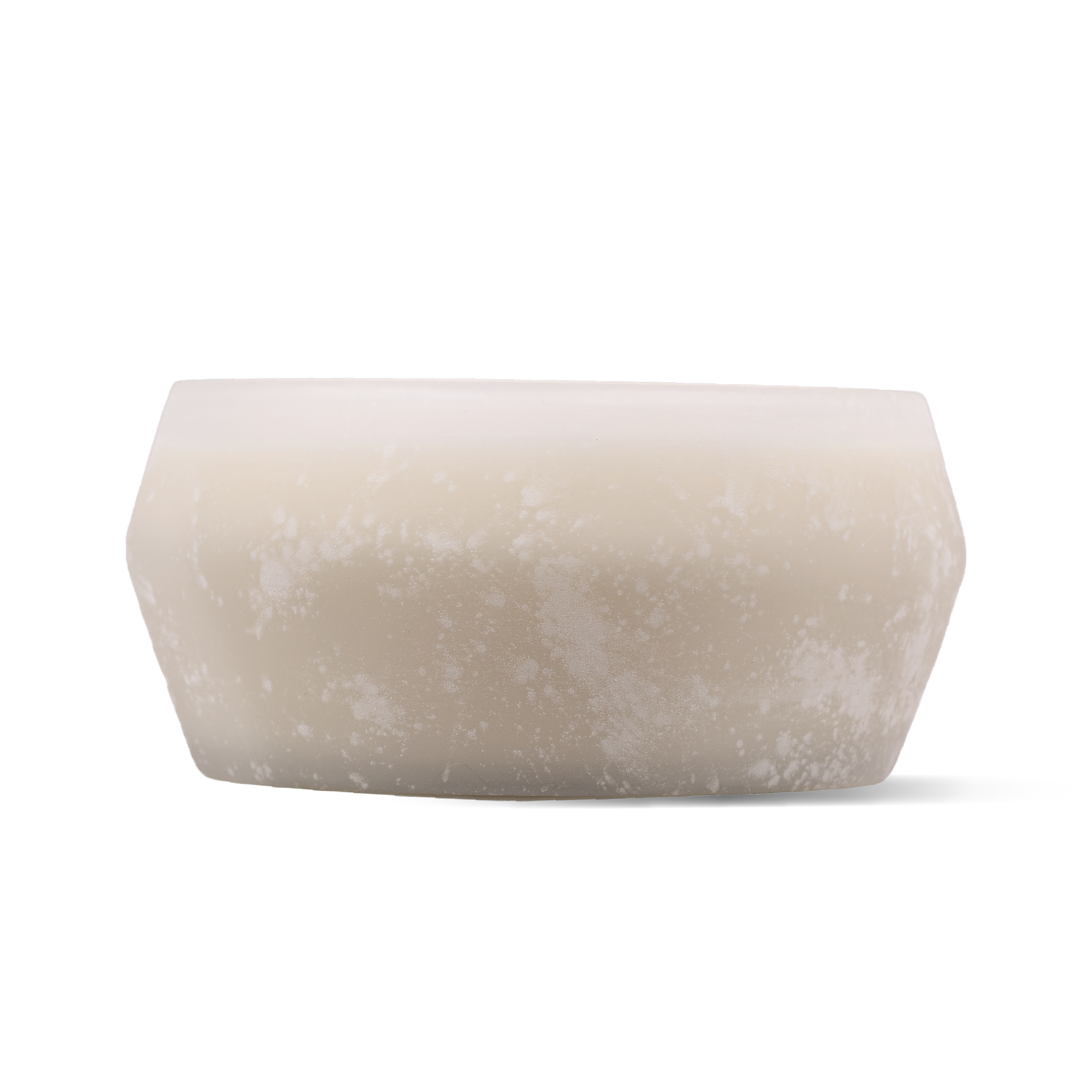 A frosted glass candle with a matte, textured finish in a warm cream-beige color