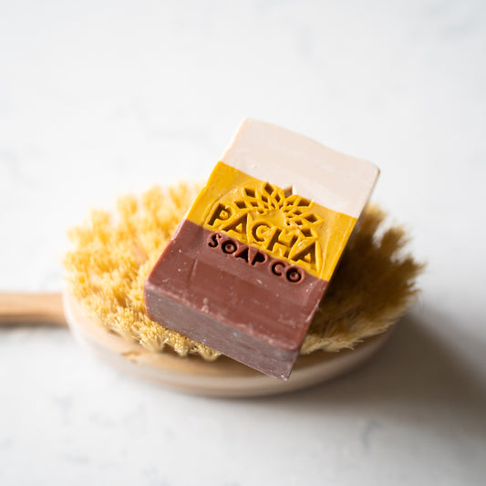 Frankincense Myrrh Bar Soap on a scrubby brush