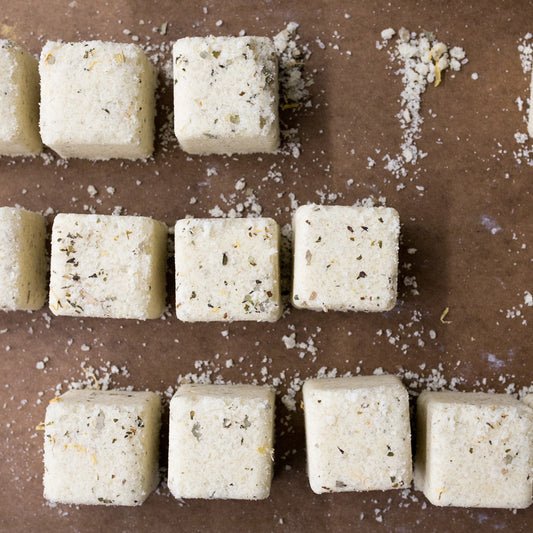 Overhead shot of Muscle Salt Blocks laid out on a brown background