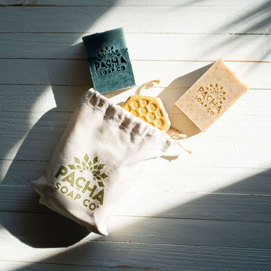 Flat lay of Reusable Canvas Gift Bag filled with bath products