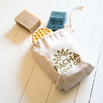 Image of Reusable Canvas Gift Bag with products spilling out